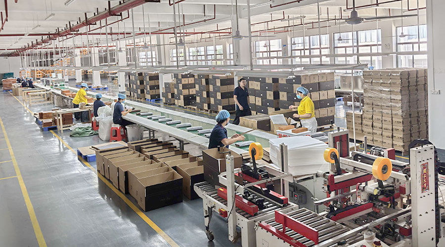 XRX Wood Box factory floor showing CNC machining and assembly lines