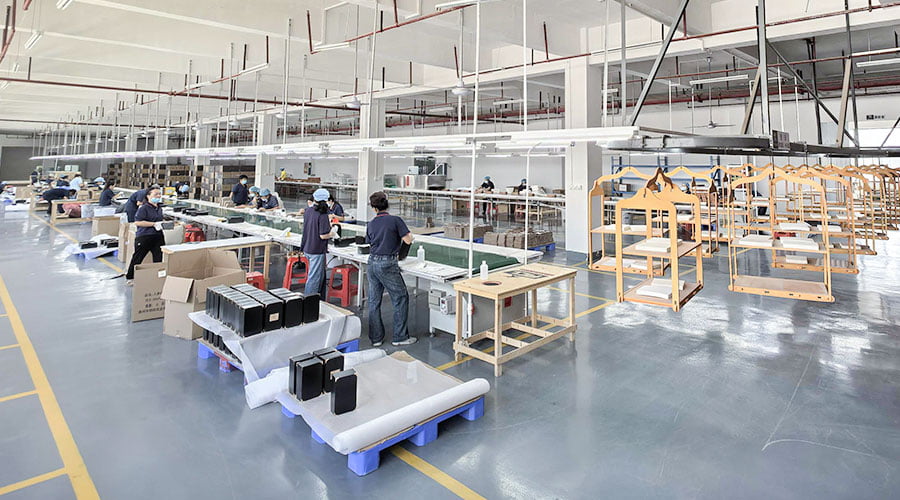 XRX Wood Box factory production floor with CNC machines and spray coating lines