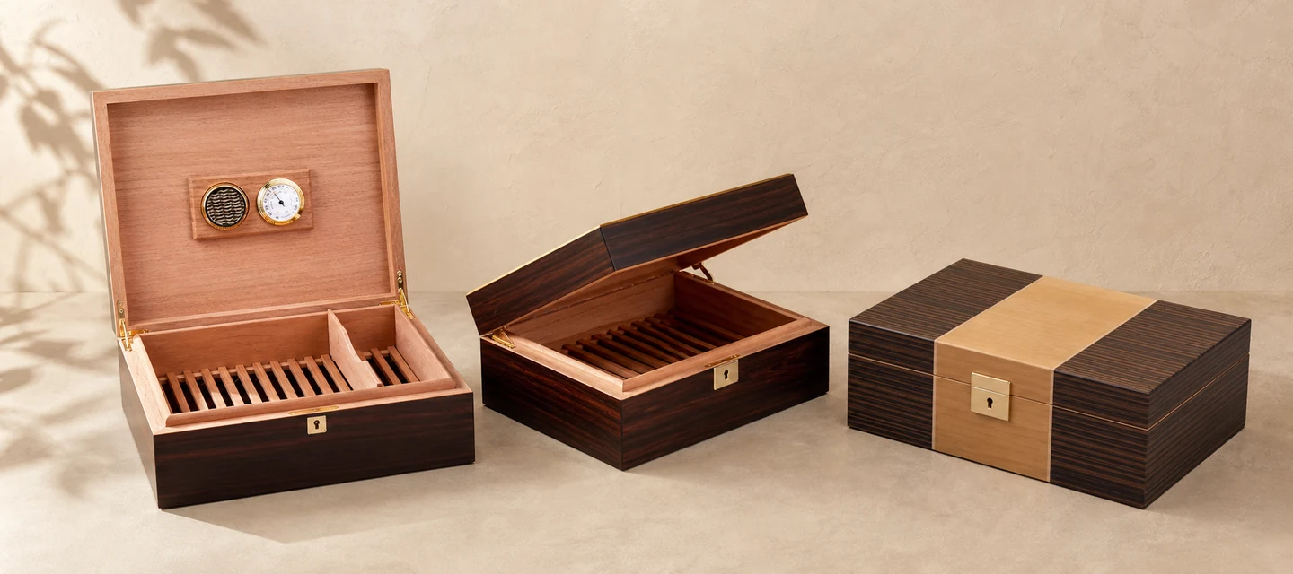 Premium cedar cigar boxes with natural wood grain finish and branded interior for luxury cigar packaging