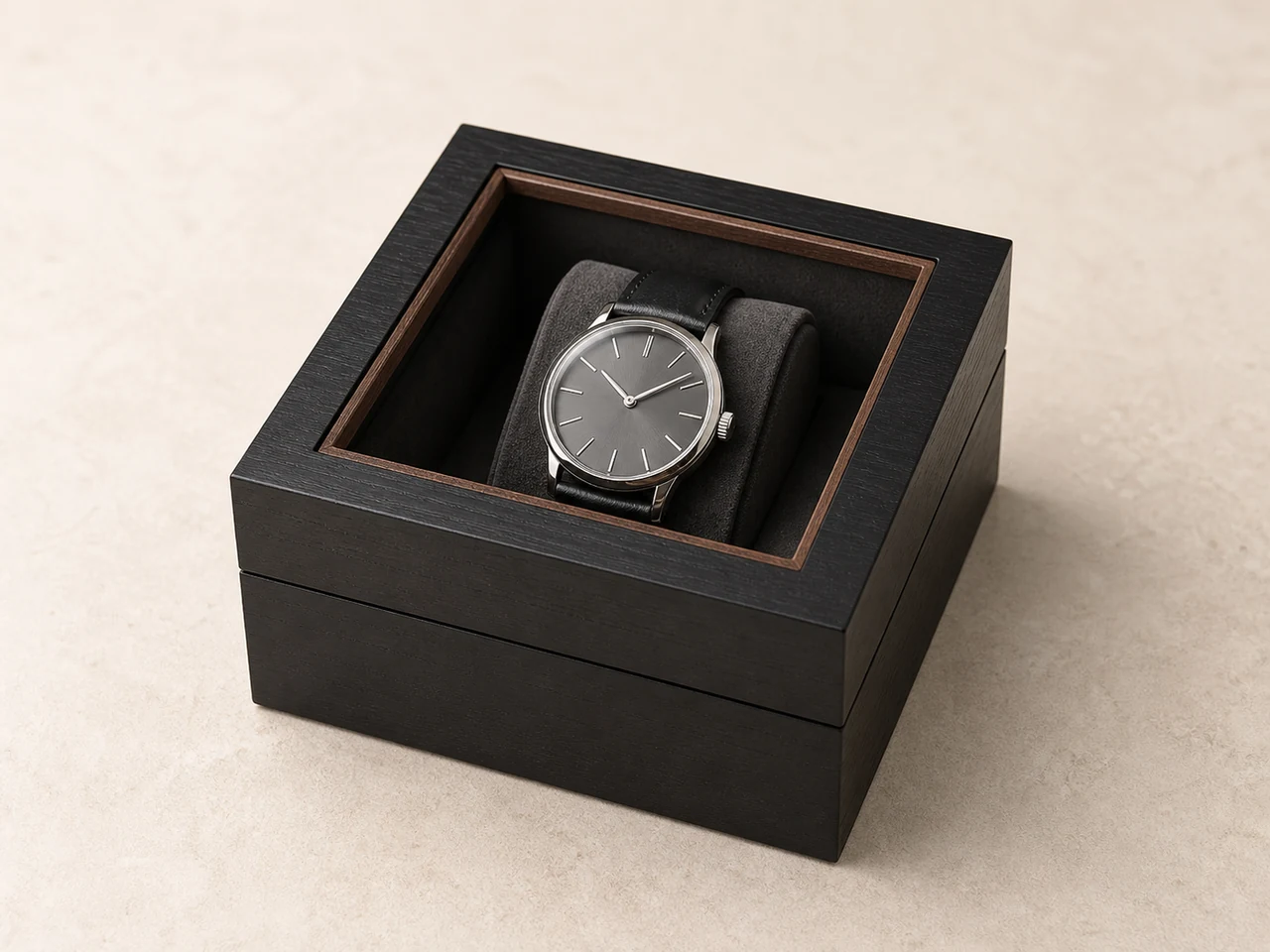 Wooden watch display box with clear acrylic window lid showing watch inside on velvet pillow
