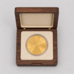 top view of walnut single coin box with cream insert