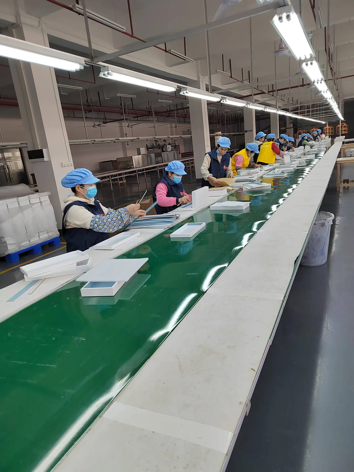 workers assembling custom wooden boxes in the XRX factory
