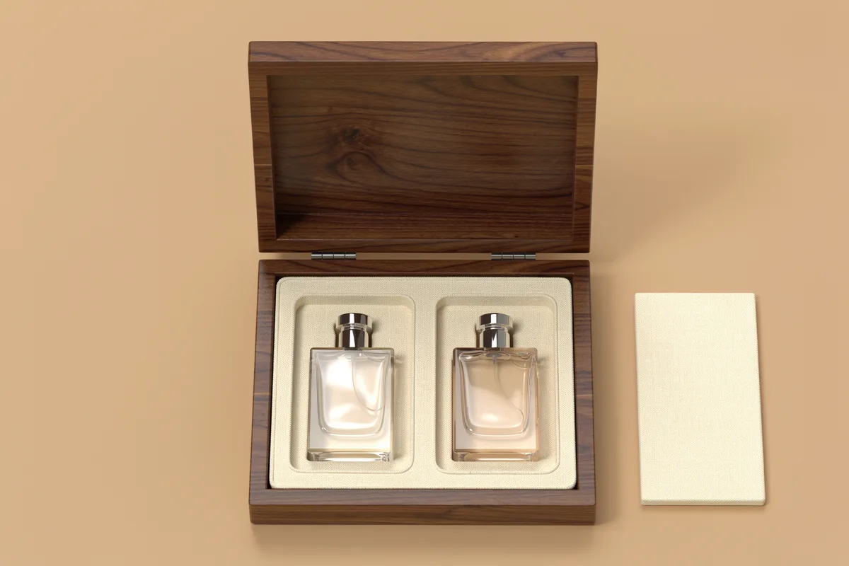 Golden sample fit review concept showing two perfume bottles in a cream-lined wooden box
