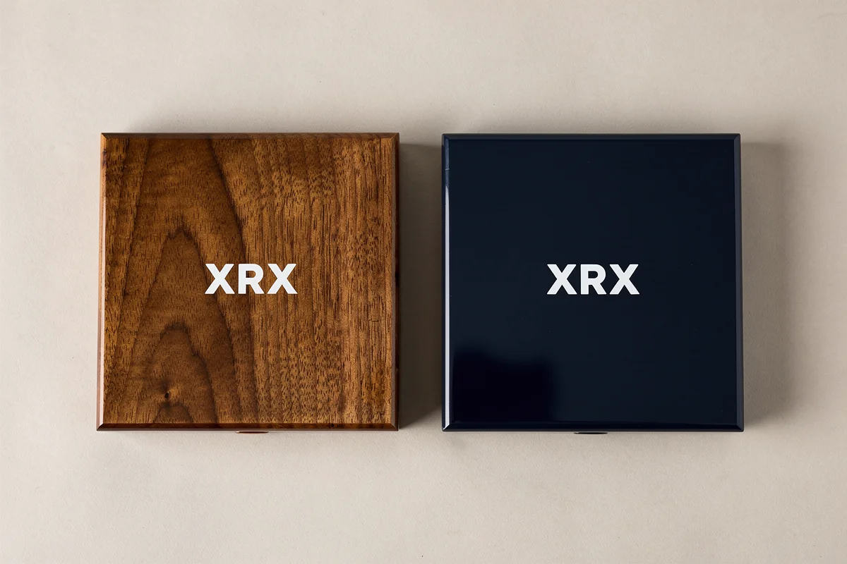 White XRX lettering on a wood-grain lid and a dark blue lacquered lid