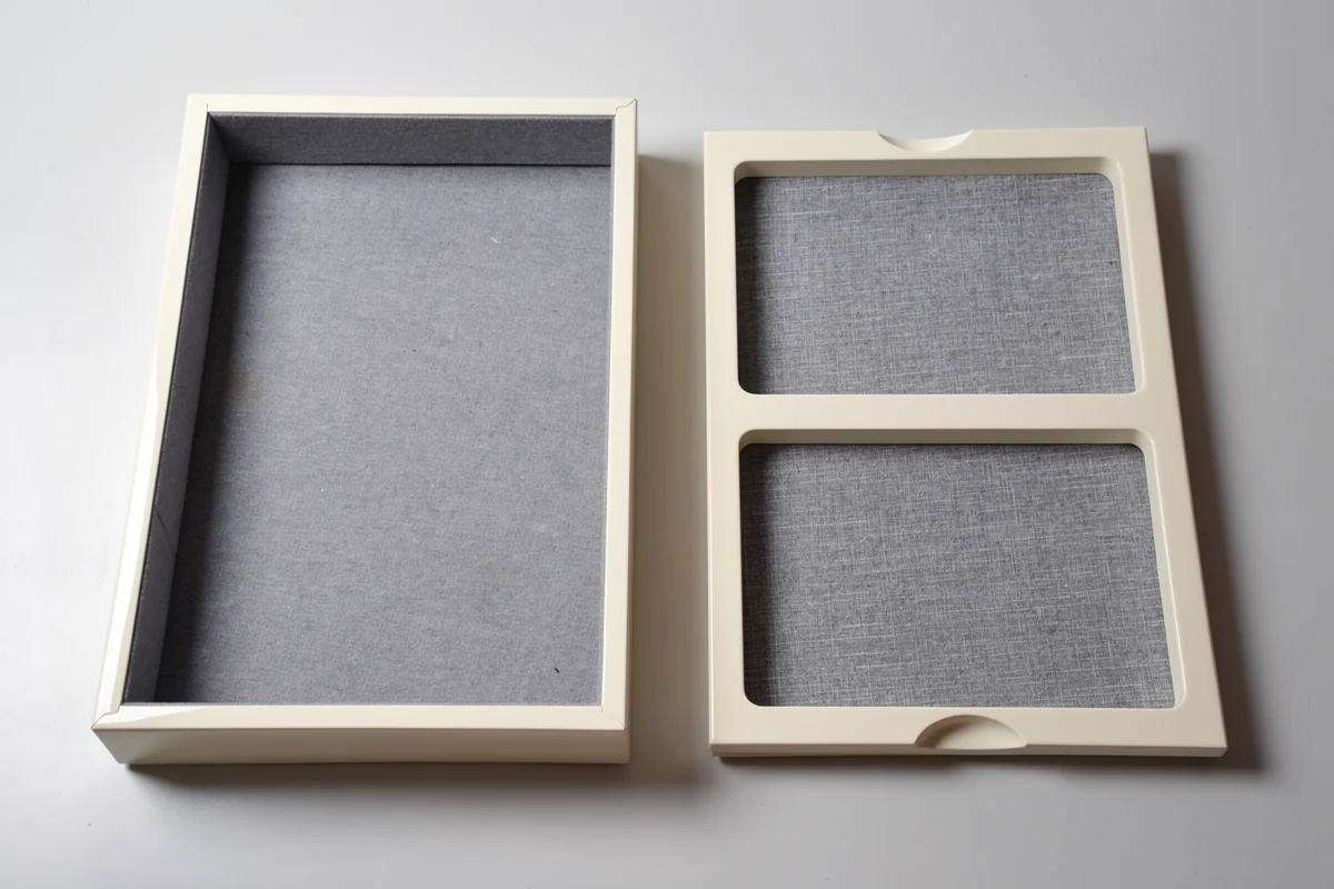 Ivory finished box and grey compartment tray with opposing finger notches